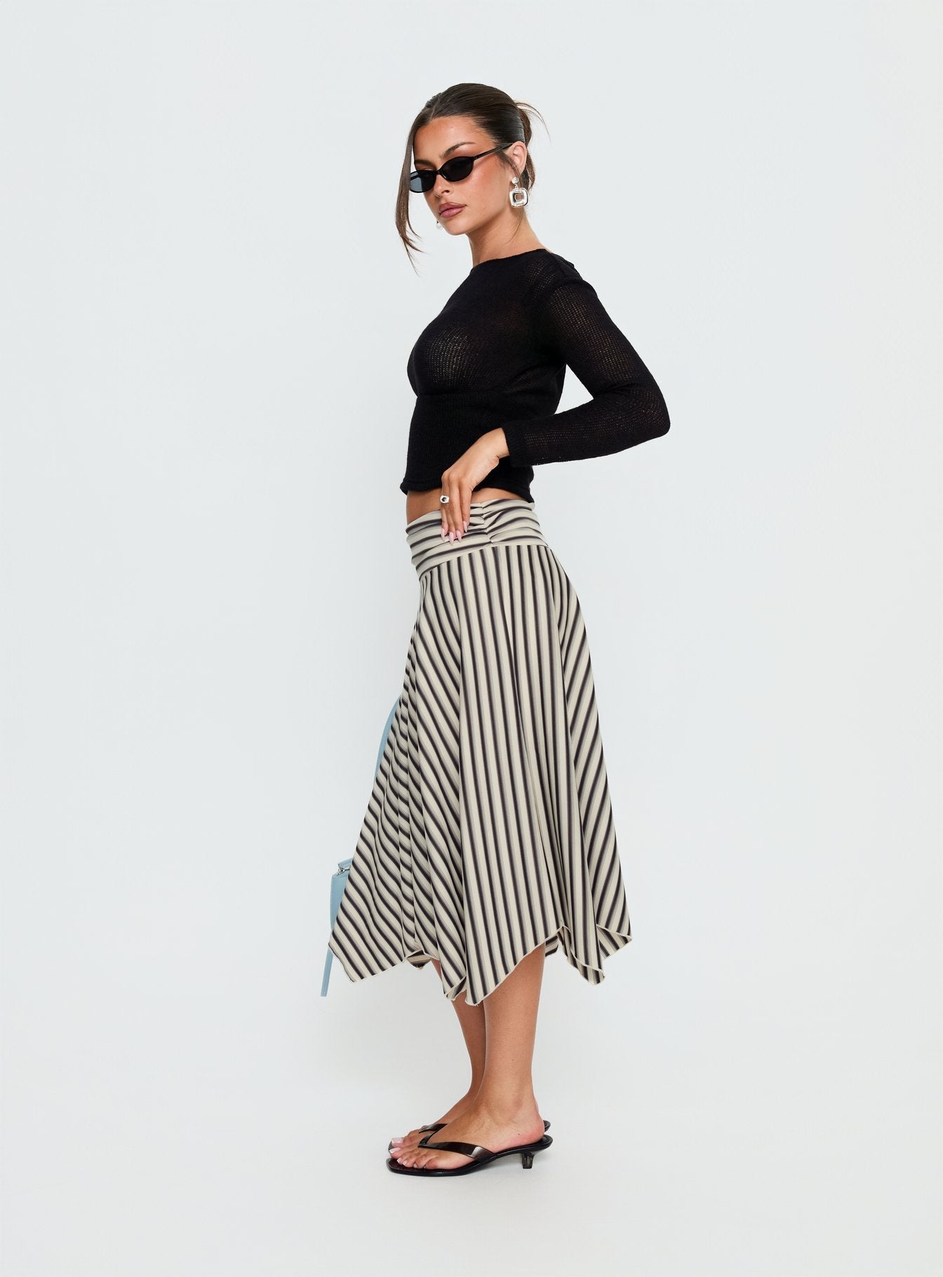   side view of model wearing Princess Polly Cobee Asymmetrical Midi Skirt Multi Stripe Midi Skirts 