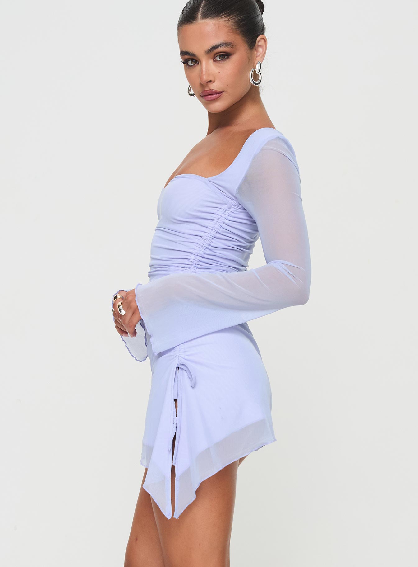 Long sleeve mini dress Mesh material, sweetheart neckline, ruching detail, asymmetric hem Good stretch, fully lined, sheer sleeves Princess Polly Lower Impact 