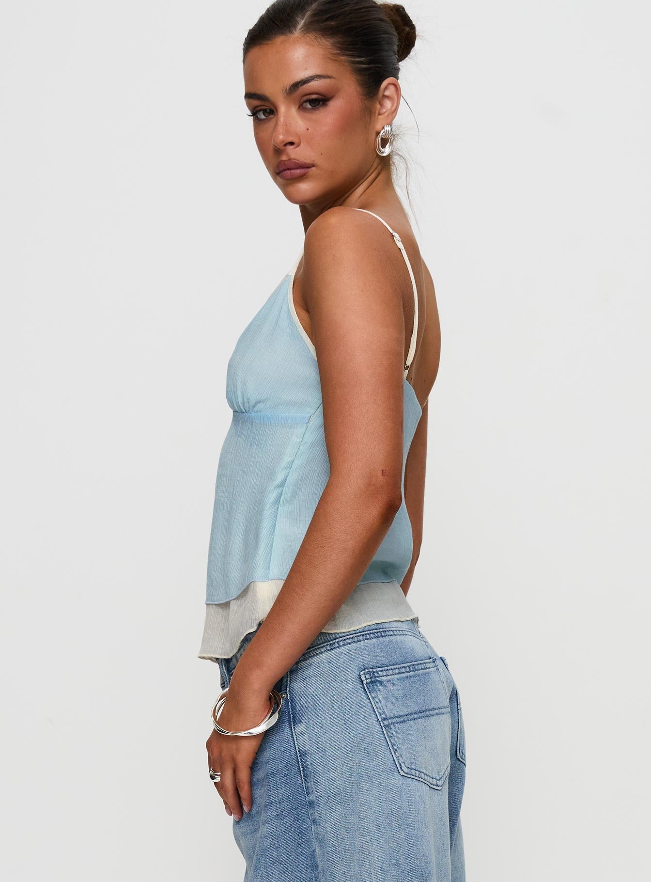 side view of model wearing Princess Polly Majorie Layered Top Blue / Cream Sleeveless V-Neck 