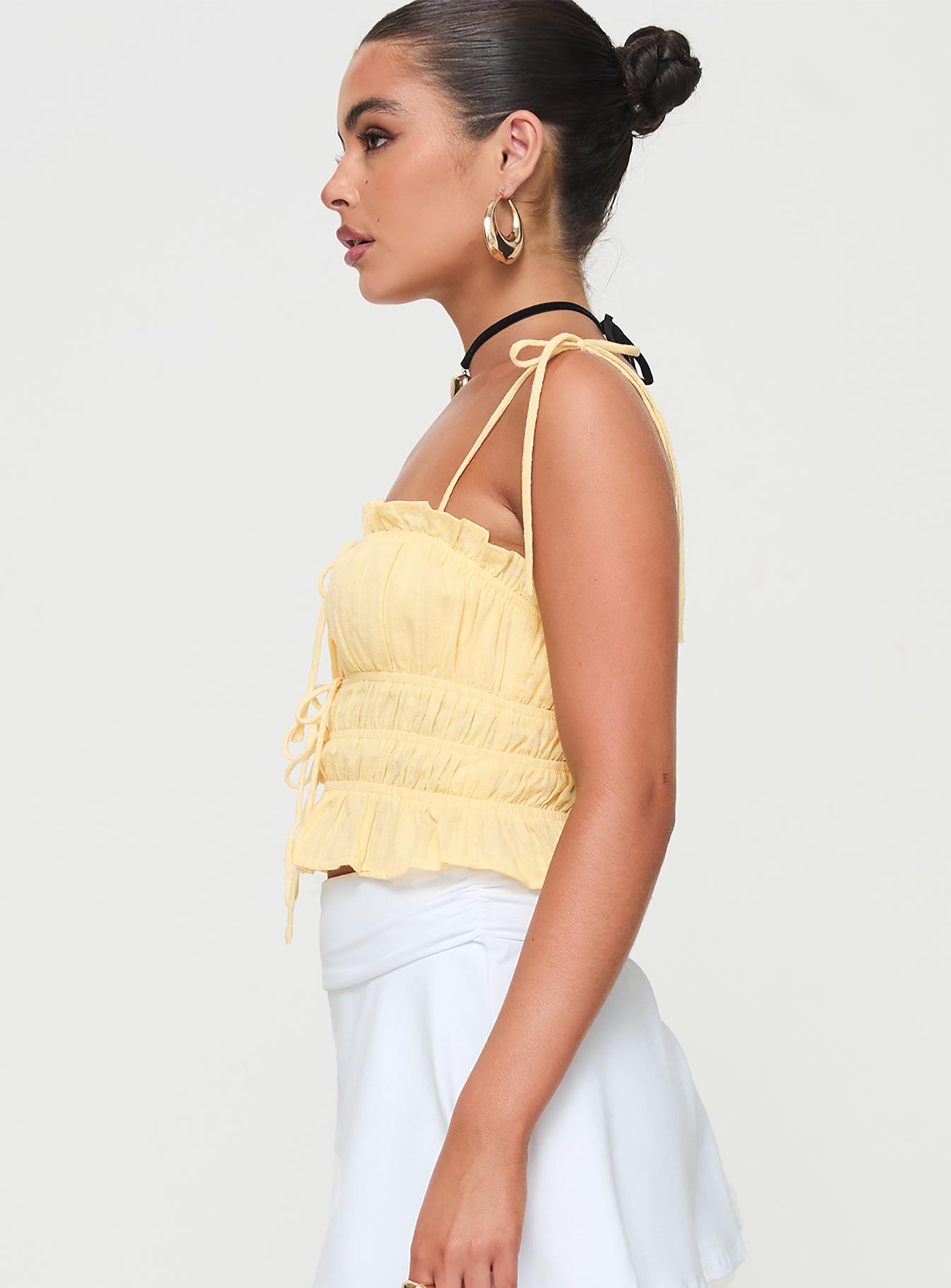 side view of model wearing Princess Polly Sars Top Yellow Sleeveless Square Neck 