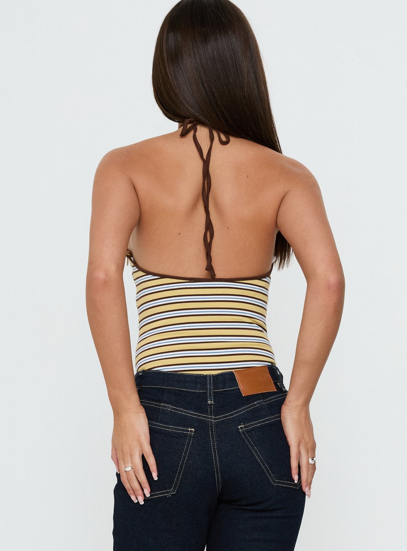 Designed with the Aethoria Arrowneck Bodysuit Multi Stripe womens bodysuit with sleeveless silhouette back view of model wearing Princess Polly