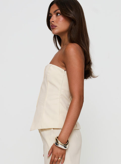 side view of model wearing Princess Polly Lavish Living Strapless Top Cream Sleeveless straight 