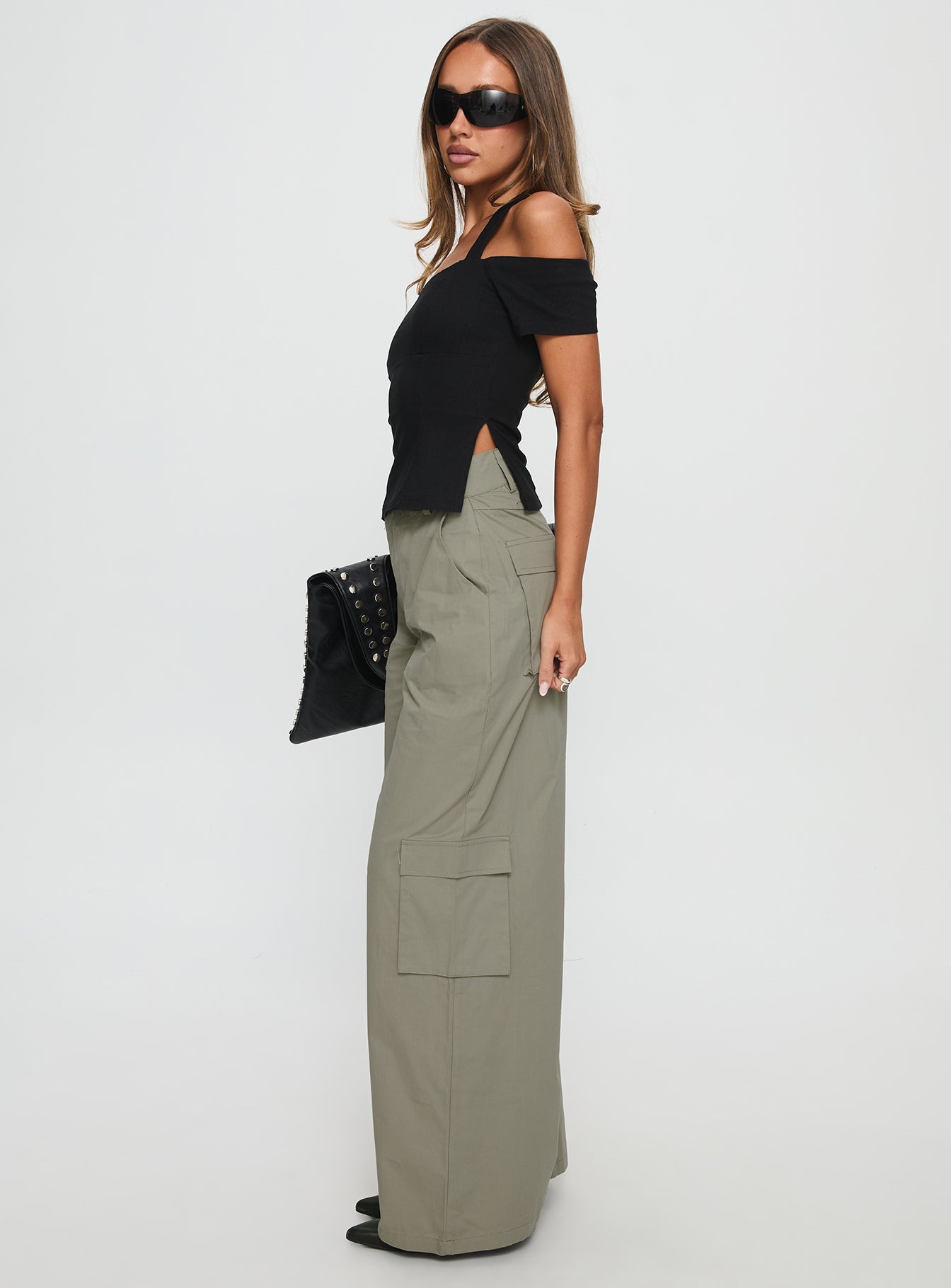side view of model wearing Princess Polly Companions Cargo Slack Pant Khaki High Waisted Pants 