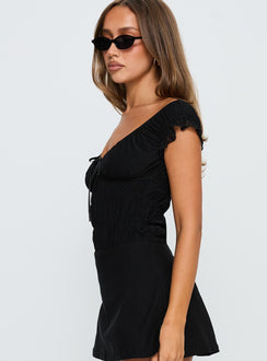 side view of model wearing Princess Polly Ahead Of Myself Off Shoulder Bodysuit Black Short Sleeves 