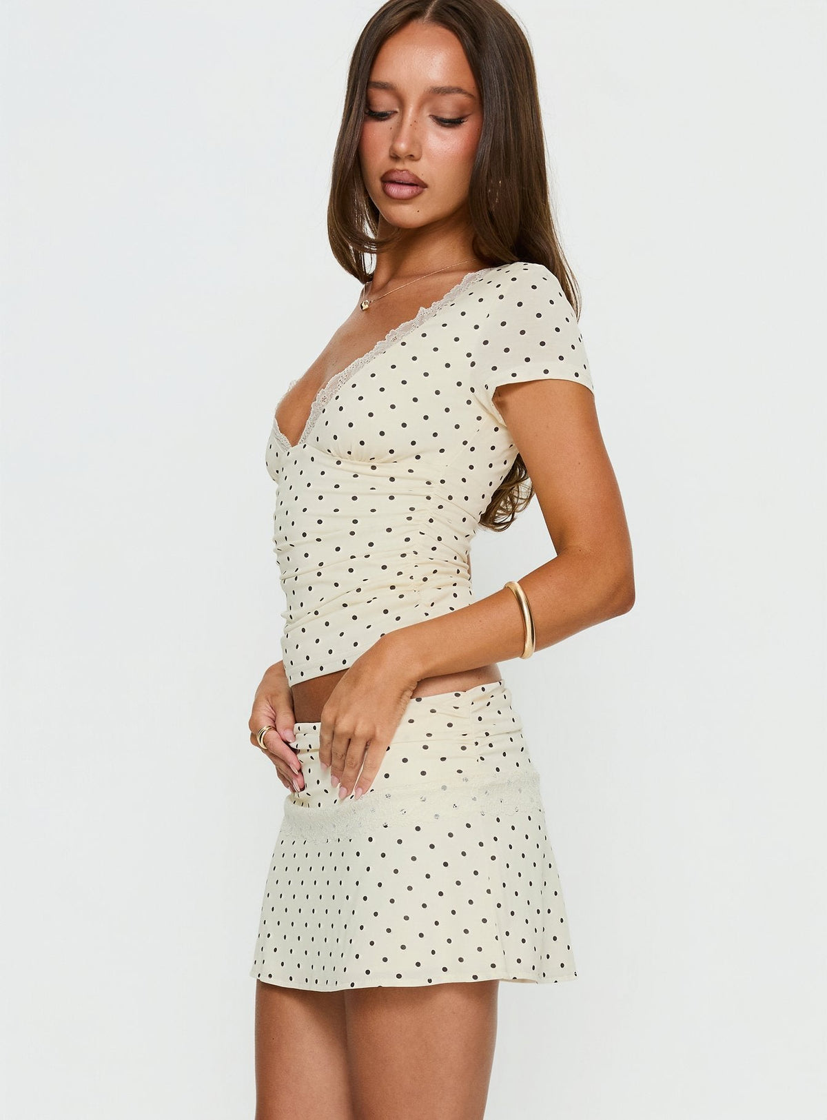   side view of model wearing Princess Polly Amia Lace Mini Skirt Cream Polka Dot Mini Skirts Skirts 