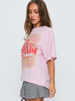 side view of model wearing Princess Polly Led Zeppelin Oversized Vintage Graphic Top Pink Half Sleeves Crew Neck 
