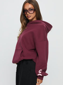 side view of model wearing Princess Polly Kisses Graphic Hoodie Wine Longline Jumpers 
