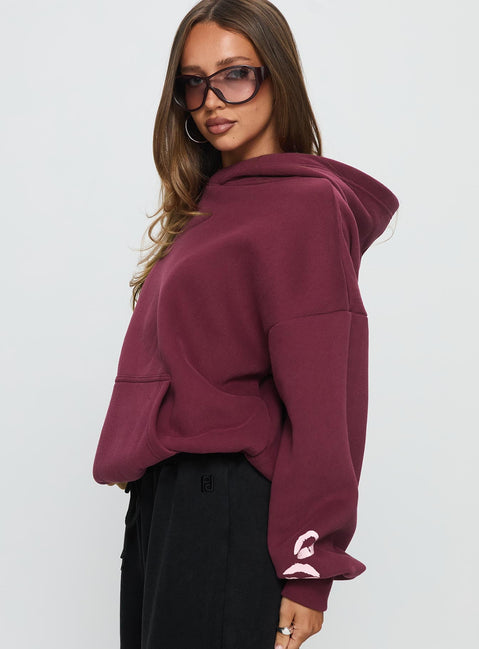 side view of model wearing Princess Polly Kisses Graphic Hoodie Wine Longline Jumpers 