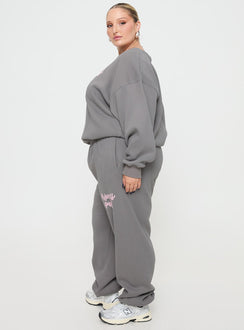 side view of model wearing Princess Polly Princess Polly Track Pants Puff Text Charcoal Curve 