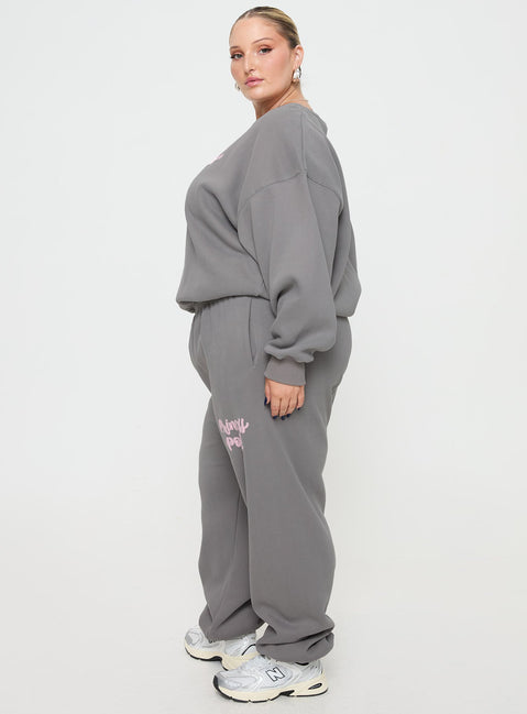 side view of model wearing Princess Polly Princess Polly Track Pants Puff Text Charcoal Curve 