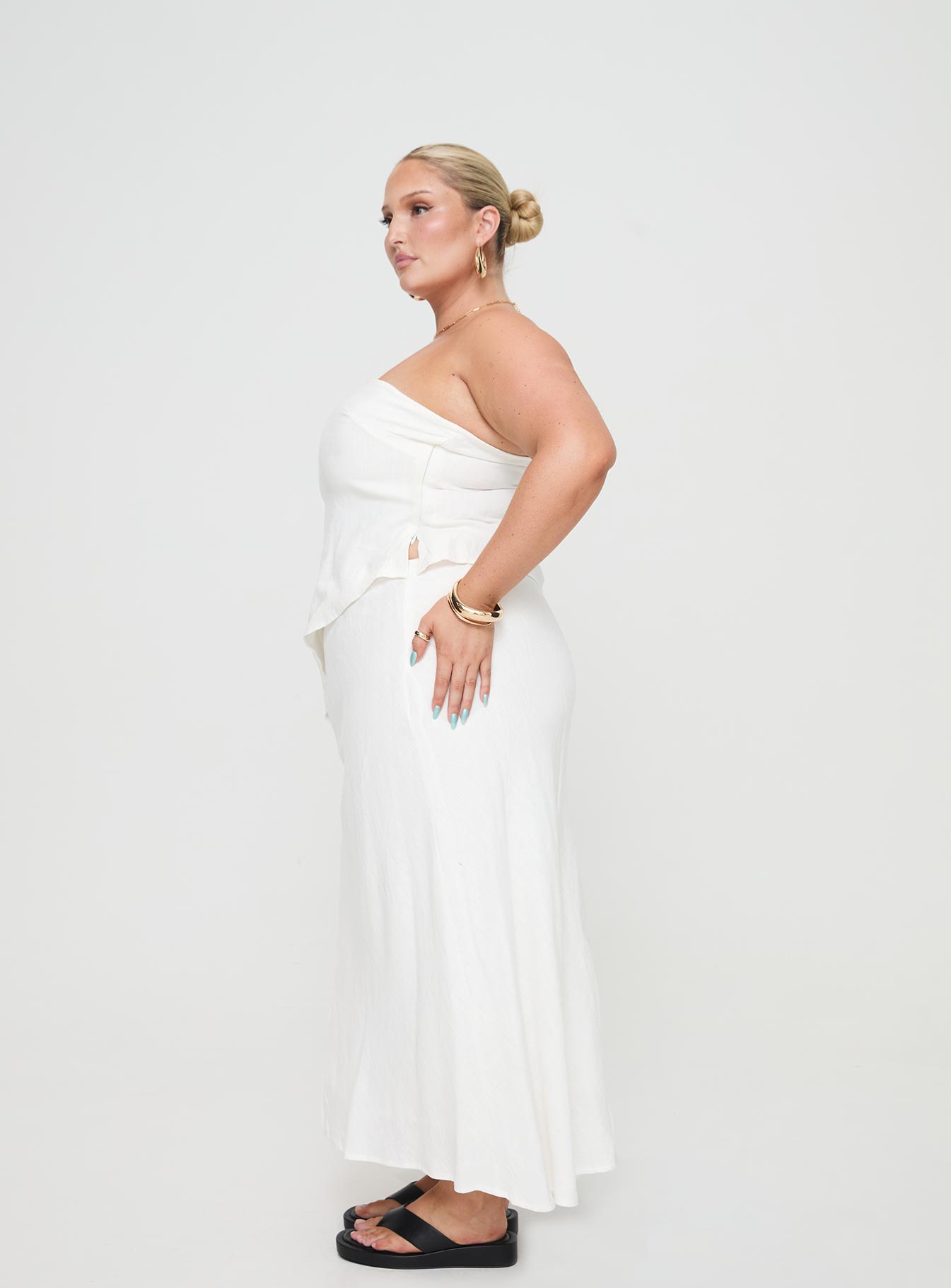 side view of model wearing Princess Polly Birdie Asymmetric Linen Blend Top White Curve Sleeveless straight 