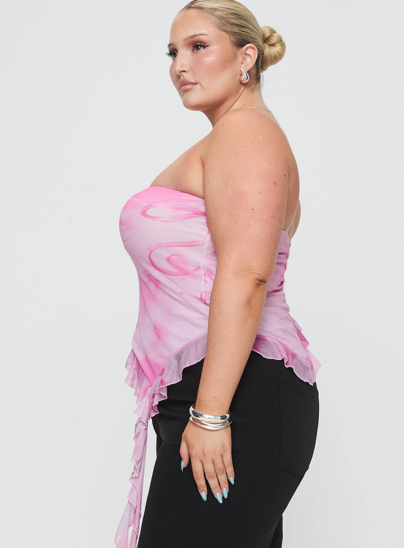 side view of model wearing Princess Polly Travessa Asymmetric Tube Top Pink Curve Sleeveless straight 