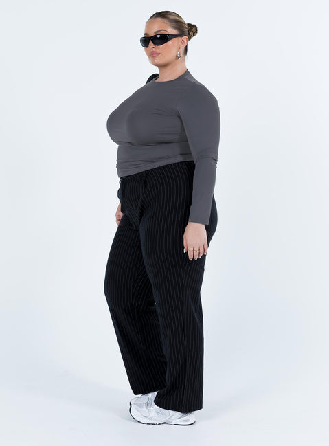 Front view of model wearing  front Princess Polly High Waisted Pants High Waisted Pants  Titius Pants Black Curve