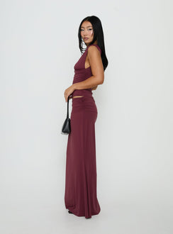 Highlighting the Liorah Foldover Waist Maxi Skirt Red in womens-skirts with a maxi length side view of model wearing Princess Polly
