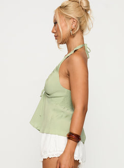 side view of model wearing Princess Polly Gadot Halter Top Green Sleeveless Plunger 