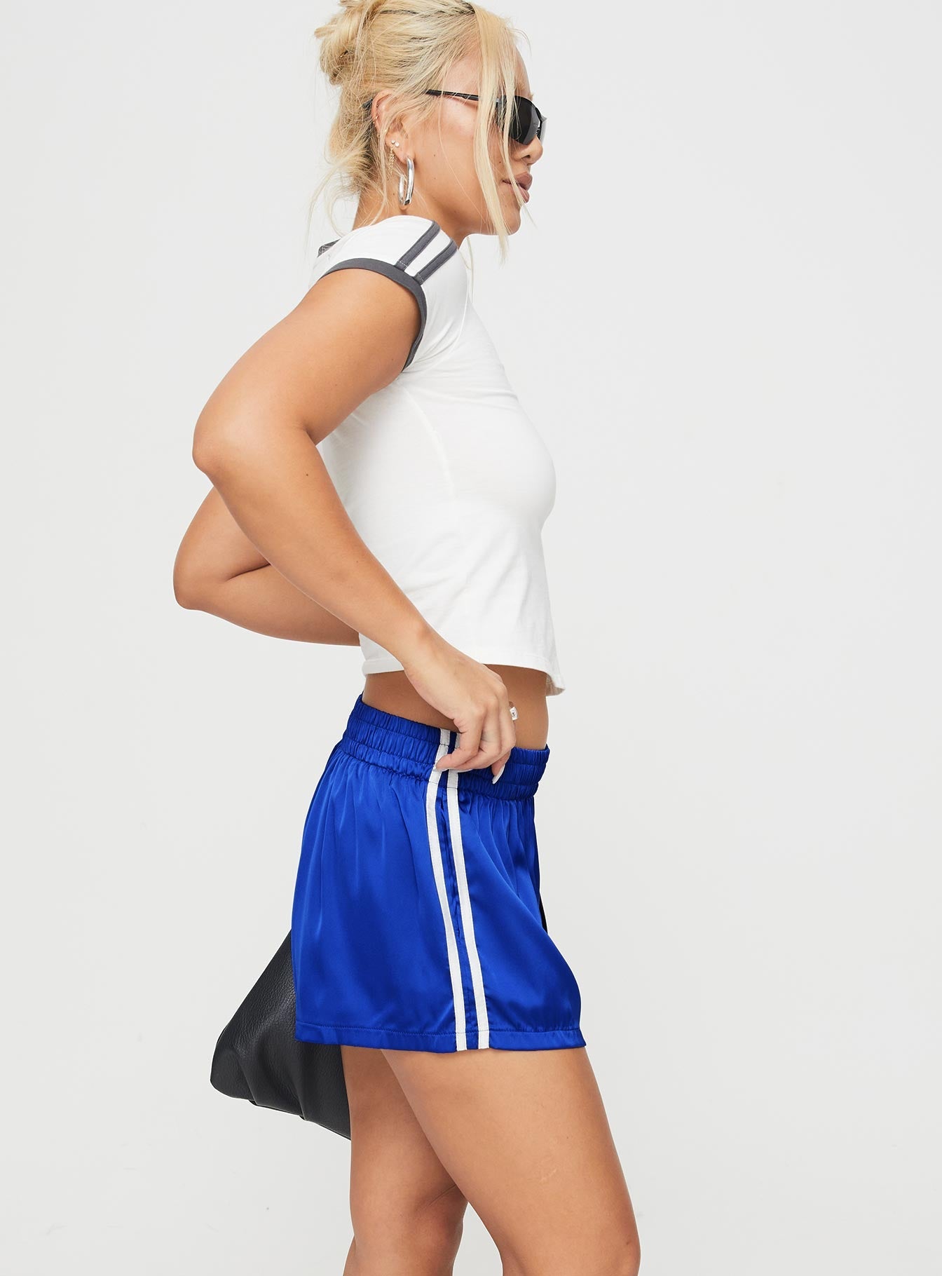 side view of model wearing Princess Polly 444 Shorts Cobalt High Waisted Shorts 