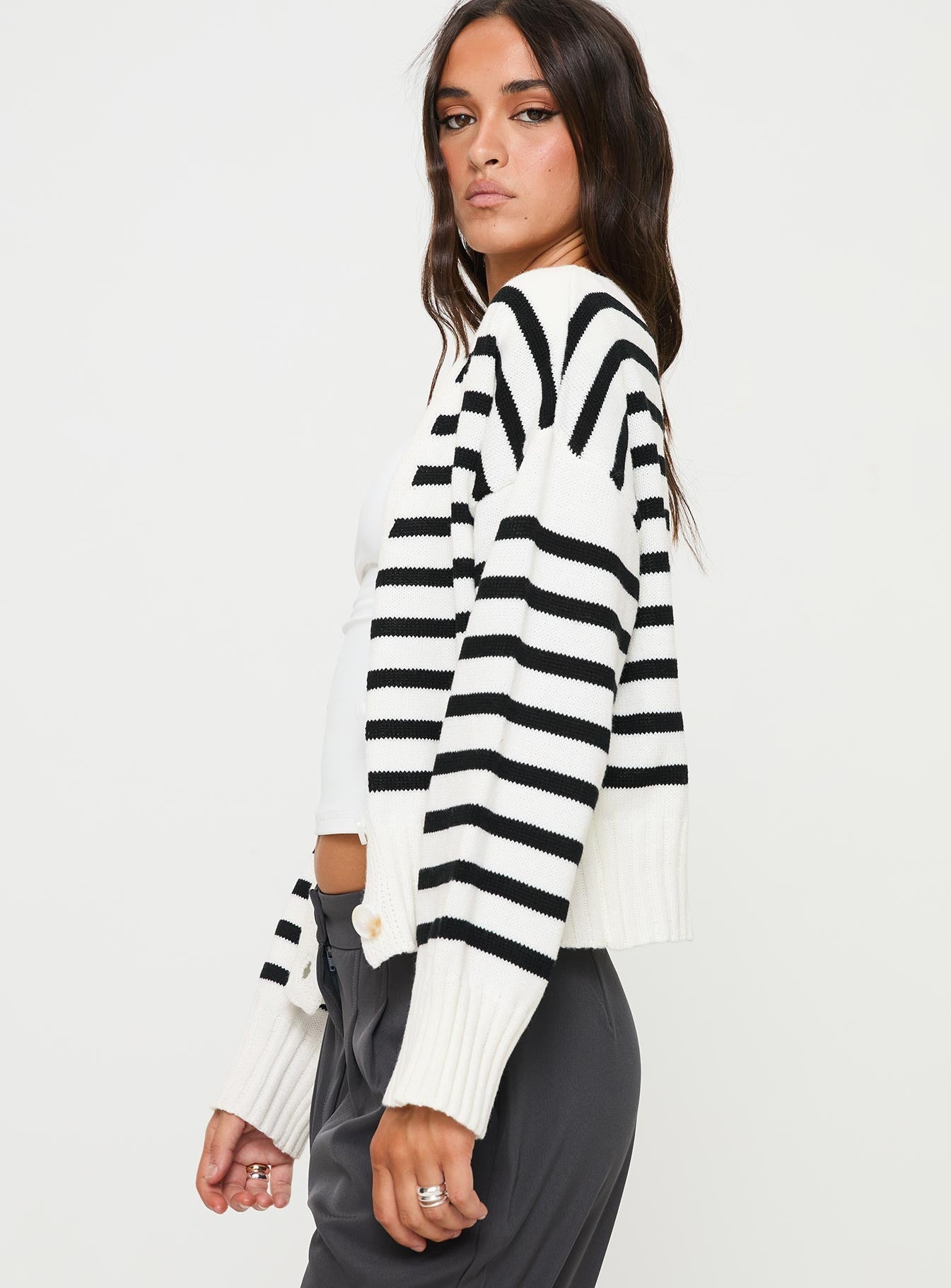 side view of model wearing Princess Polly Karlson Striped Cardigan Cream / Black cropped 