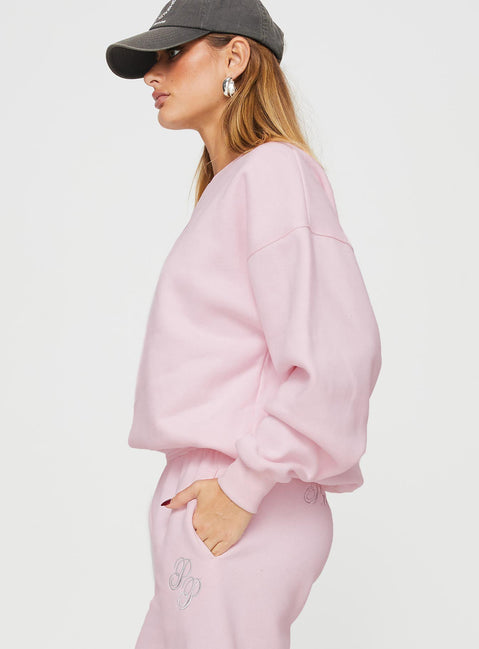 side view of model wearing Princess Polly Princess Polly Crew Neck Sweatshirt Script Baby Pink / Grey 