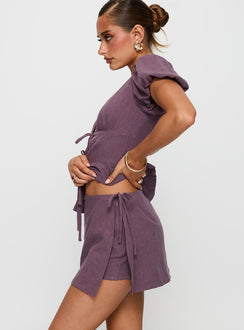 side view of model wearing Princess Polly Gulliver Tie Side Mini Skort Mauve High Waisted Shorts 
