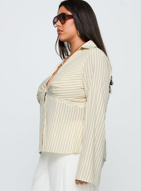 side view of model wearing Princess Polly Life Begins Long Sleeve Lace Trim Top Cream Stripe Curve Full Sleeves Plunger 