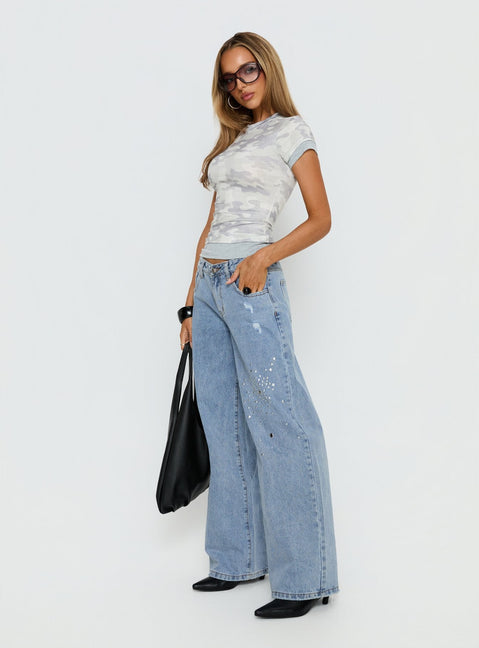 side view of model wearing Princess Polly Candi Mid Rise Wide Leg Studded Jeans Light Blue Wash Mid Rise Jeans 