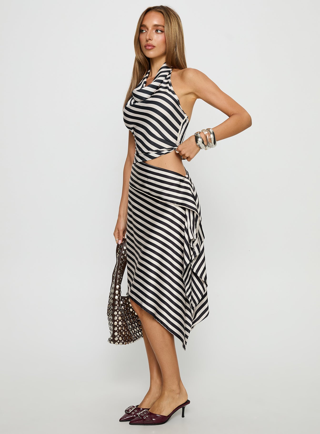   side view of model wearing Princess Polly Allure Midi Skirt Noir Stripe Midi Skirts 