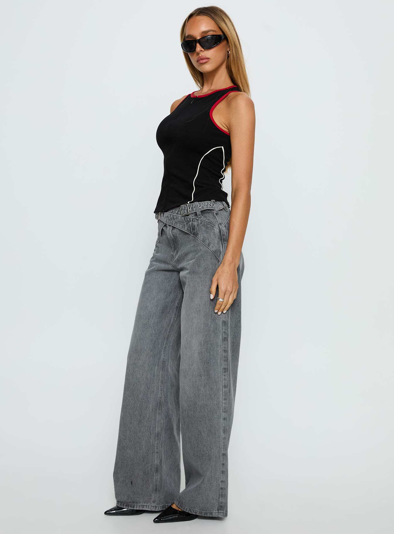 side view of model wearing Princess Polly Mckinley Mid Rise Wide Leg Jeans Washed Grey Mid Rise Jeans 