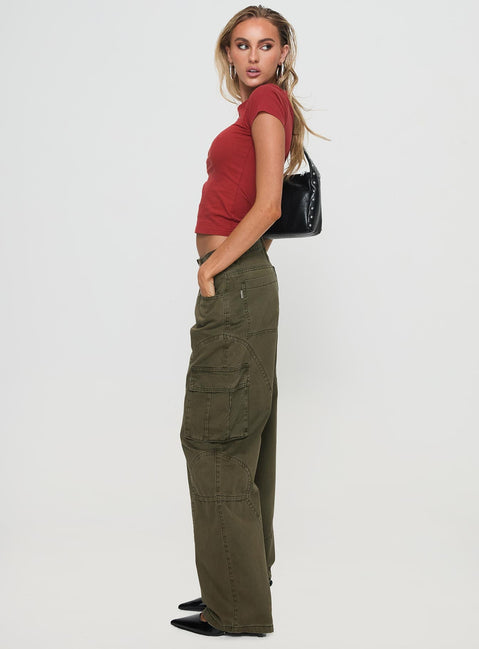 side view of model wearing Princess Polly Ahstin Cargo Jeans Green Low Rise Jeans 