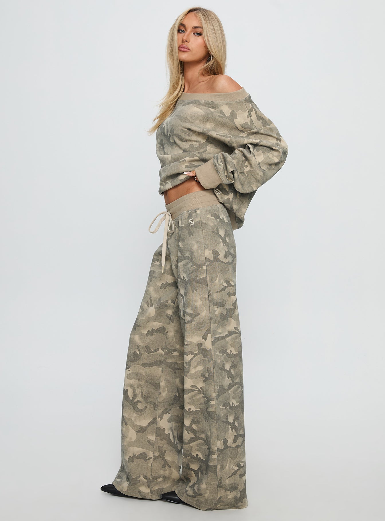 side view of model wearing Princess Polly Dodie Wide Leg Pants Camo High Rise Pants 