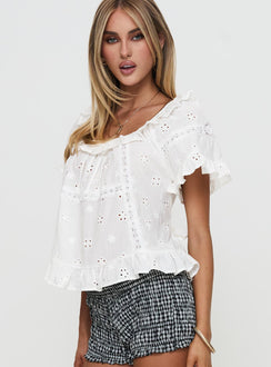 side view of model wearing Princess Polly Teigen Broiderie Top White Short Sleeves Square Neck 