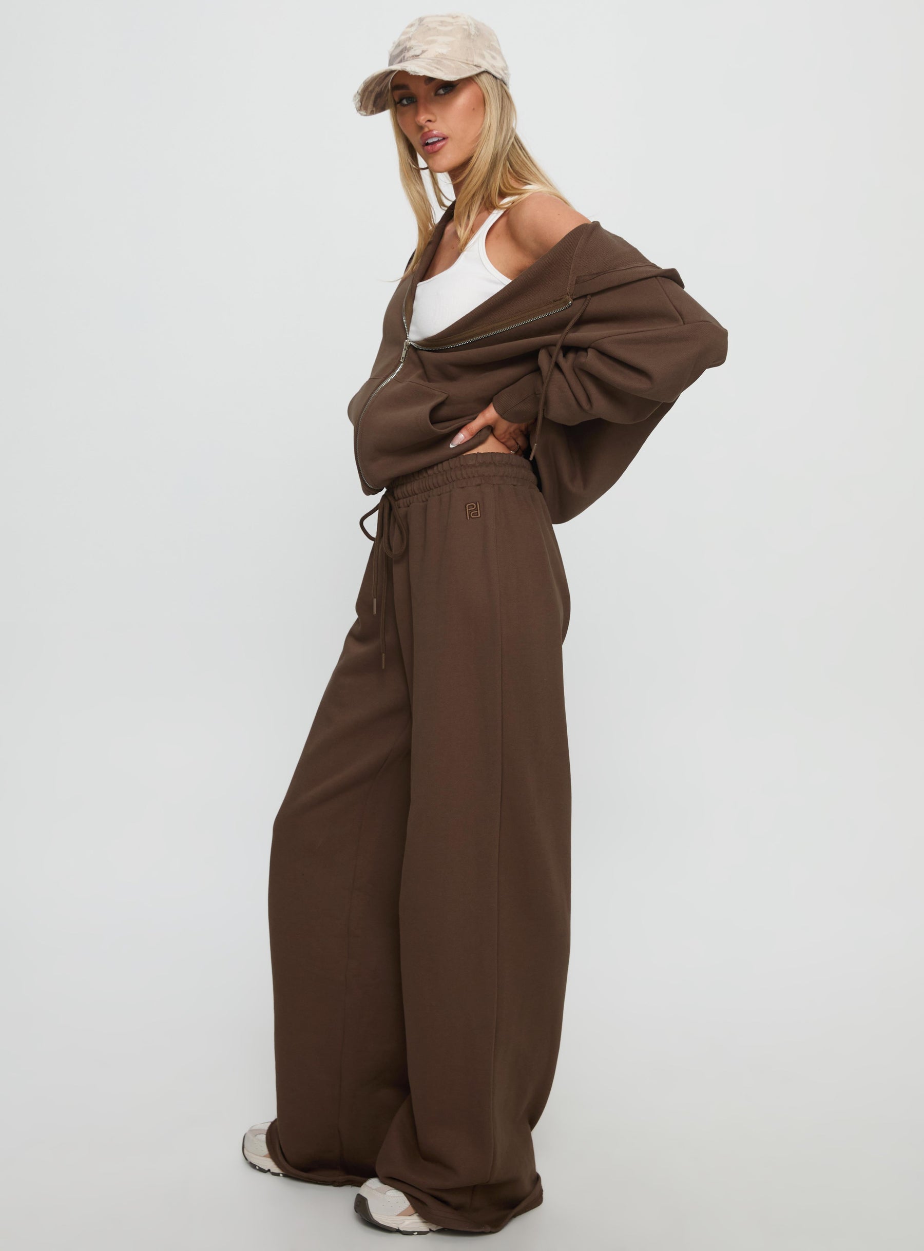 side view of model wearing Princess Polly All Day Straight Leg Sweatpants Chocolate Brown High Rise Pants 