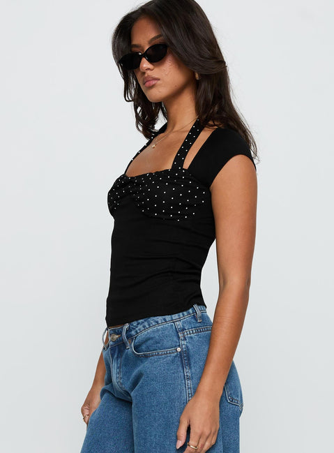 side view of model wearing Princess Polly Emberglow Top Black / Polka Short Sleeves Square Neck 