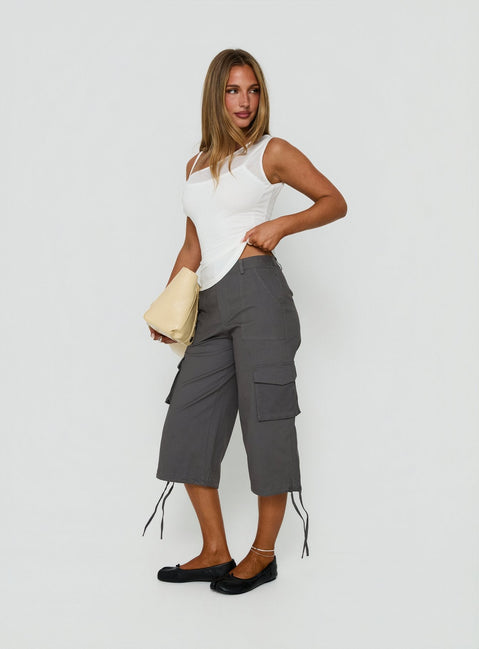 Showcasing the Alfonza Utility Capri in Slate womens-regular-pants with mid-rise cargo design side view of model wearing Princess Polly