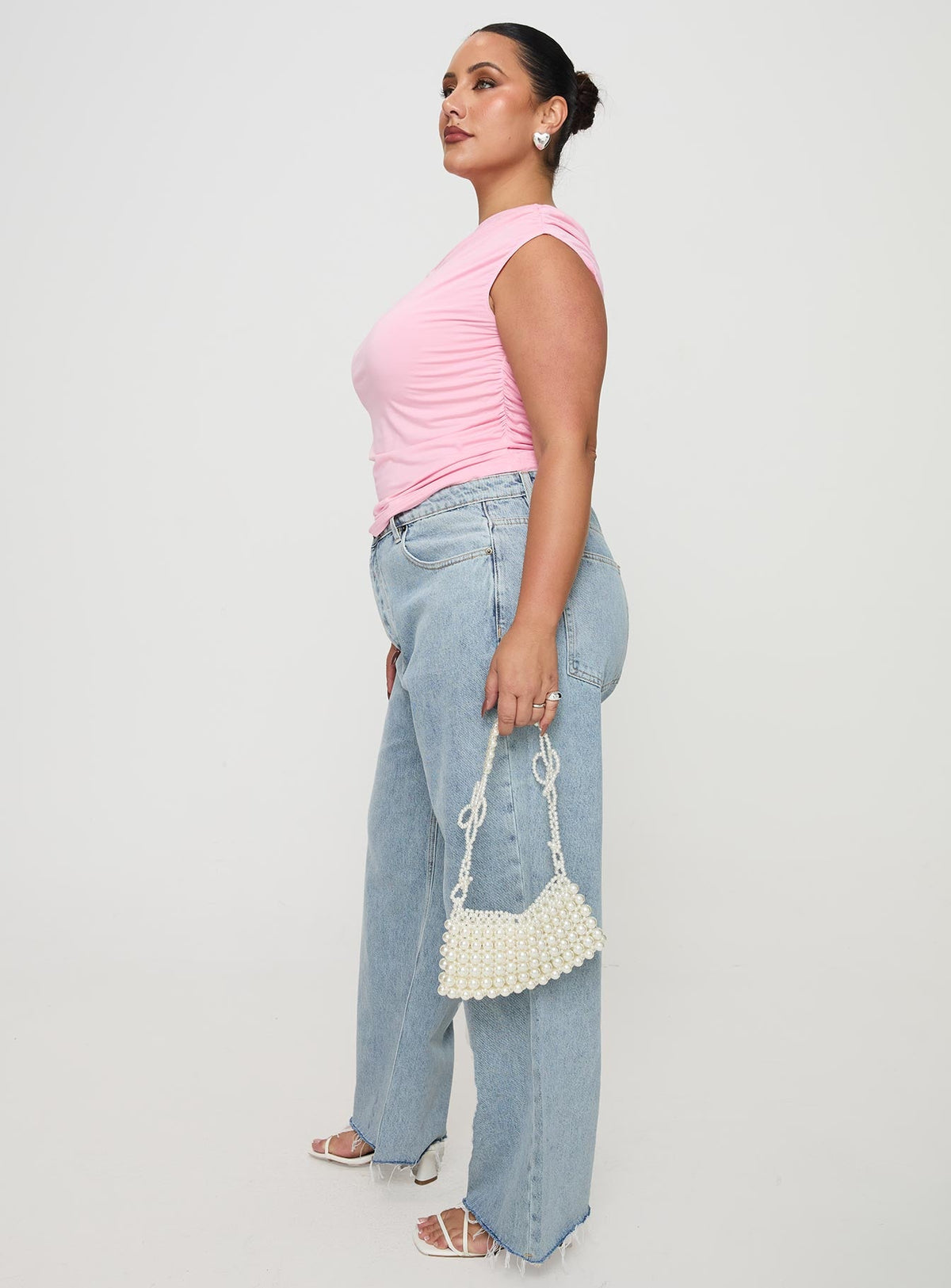side view of model wearing Princess Polly Fawcett High Rise Straight Leg Jeans Light Blue Wash Curve High Rise Jeans Jeans 