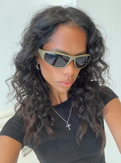 Sunglasses Wrap around design Light weight frame Brown tinted lenses Moulded nose bridge