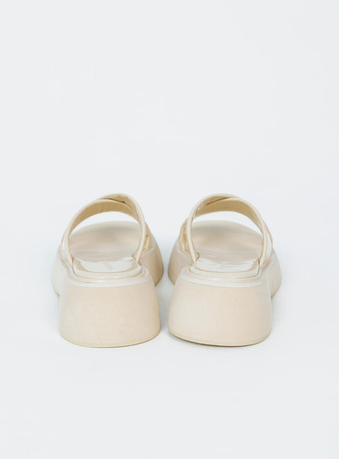 Flats Faux leather material  Cross strap upper  Platform base 