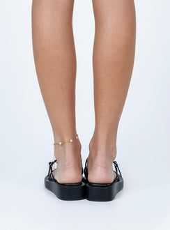 Sandals Princess Polly Exclusive  Faux leather material  Strappy upper  Buckle fastening  Padded footbed  Platform base 