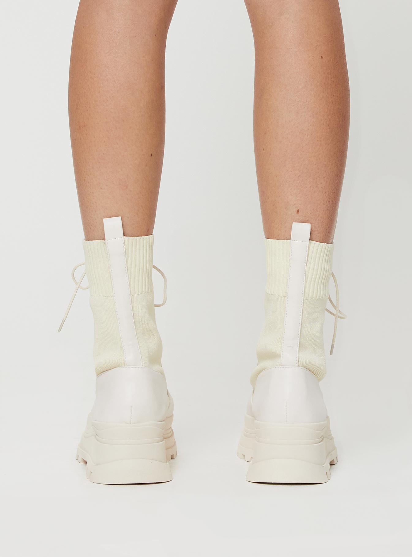 Knit & PU boots Platform base, lace fastening, rounded toe, padded footbed, treaded sole