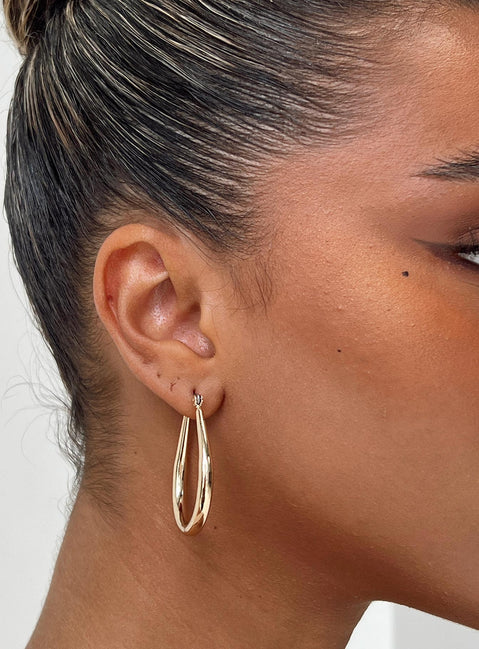 Gold earrings Gold toned Hoop fastening