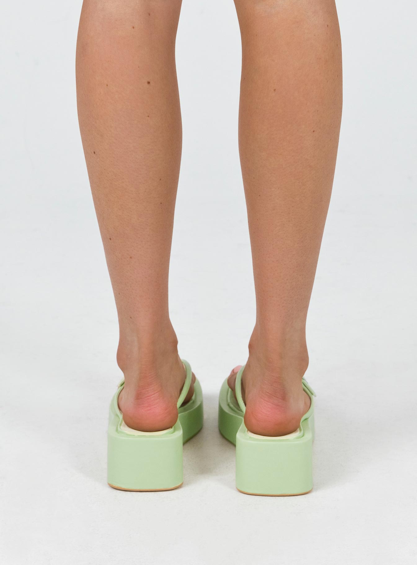 Sandals Flip-flop style upper Silver-toned buckle detail Platform base Square toe  Padded footbed 