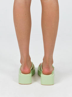 Sandals Flip-flop style upper Silver-toned buckle detail Platform base Square toe  Padded footbed 