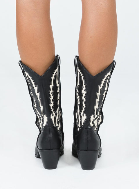 Cowgirl boots Faux leather material  Detail stitching  Mid-calf length  Pull tabs  Pointed toe Block heel 