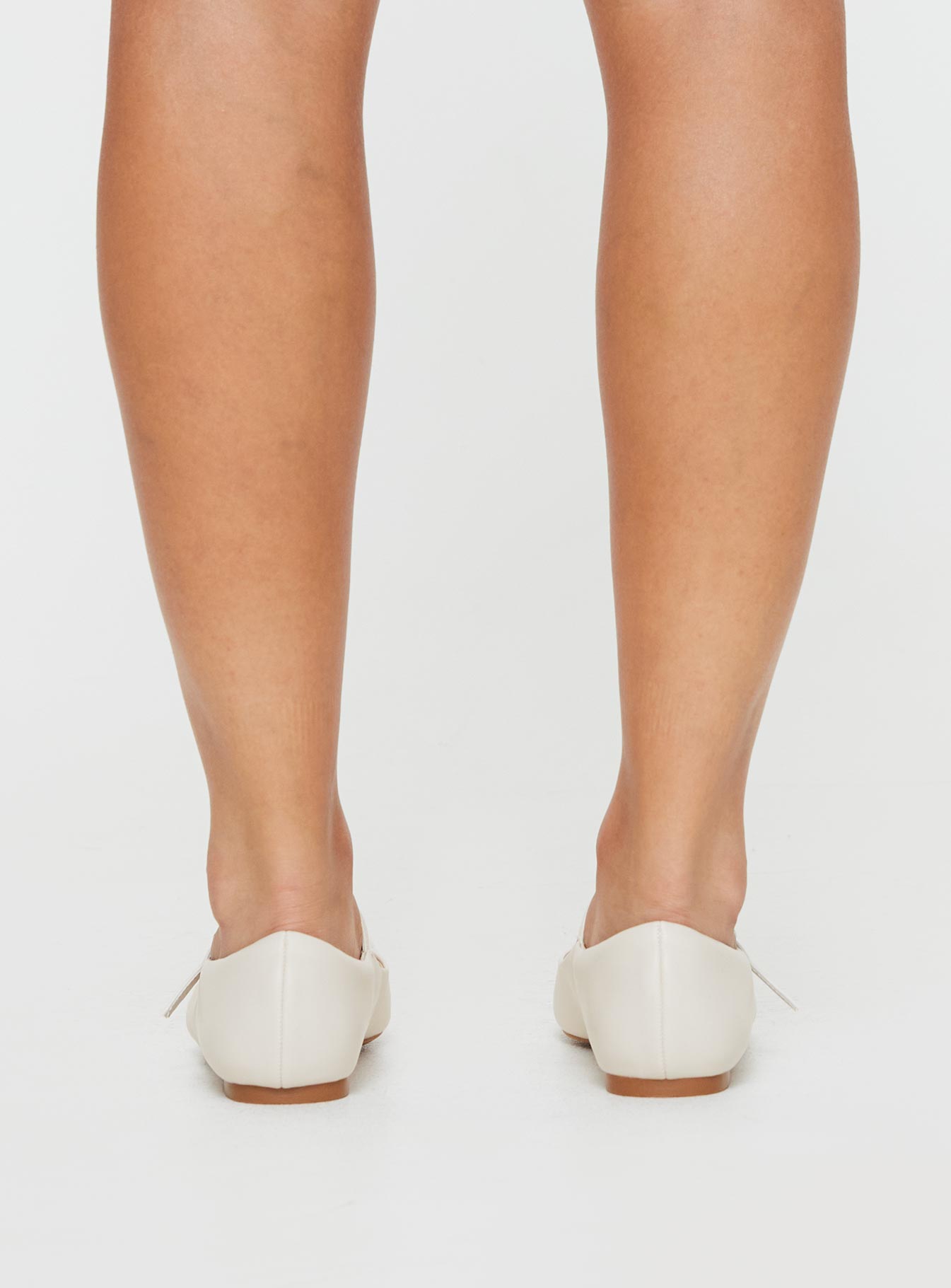 Faux leather ballet flats Single strap upper, square toe, padded footbed, buckle fastening