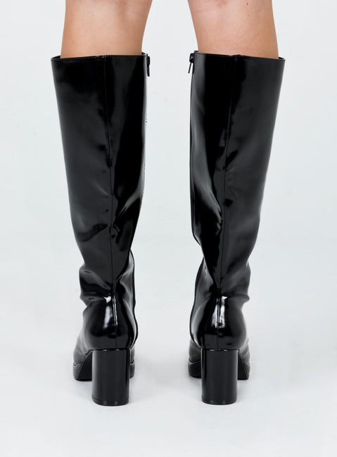 Knee high boots Princess Polly Exclusive Upper: 100% PU Lining: 100% fabric Outsole: 100% rubber Faux glossy leather  Zip fastening at side  Block heel  Rounded toe 