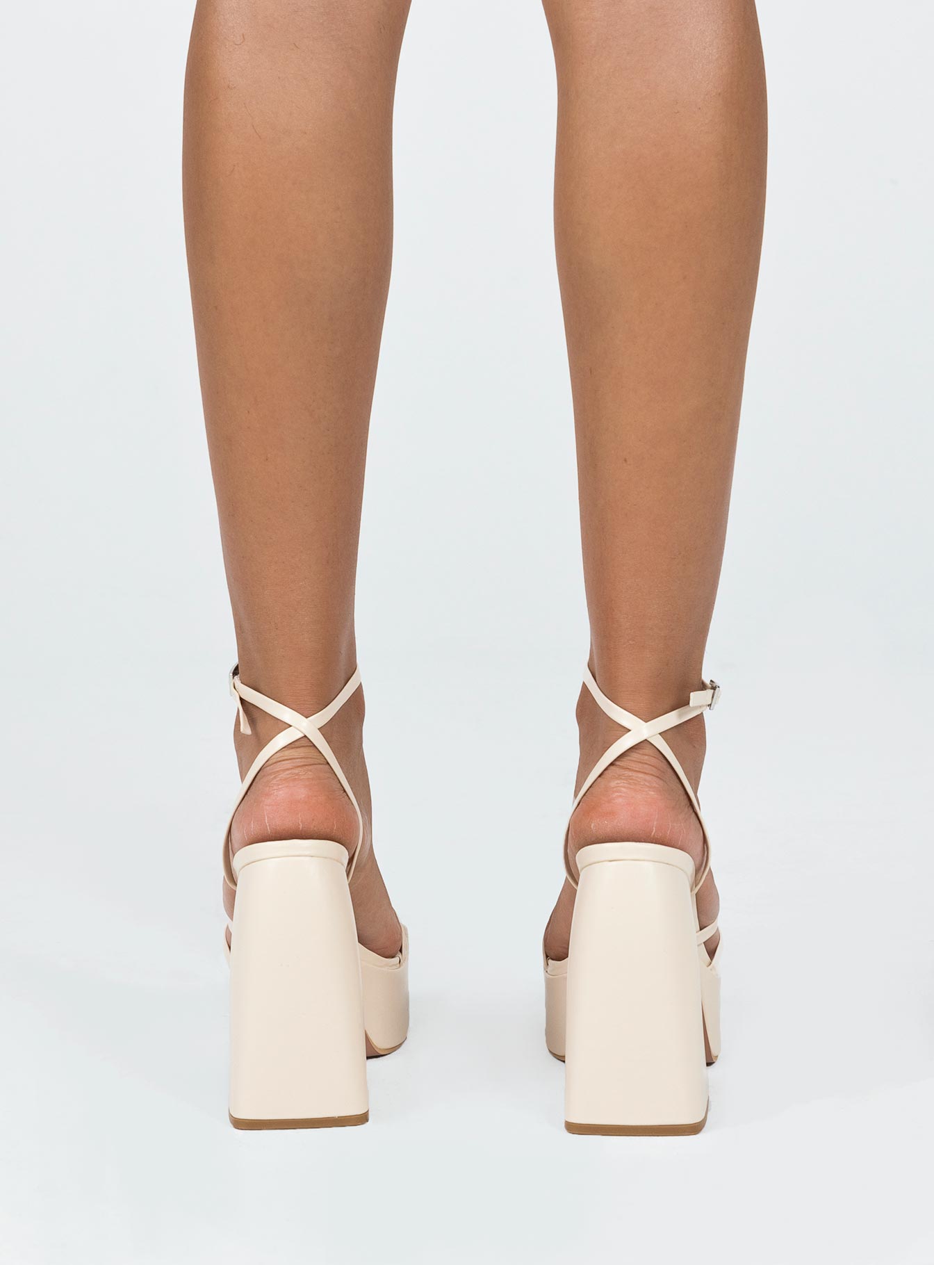 Platform heels  Faux leather material  Square toe Strappy upper Block heel  Ankle buckle fastening  Platform base 