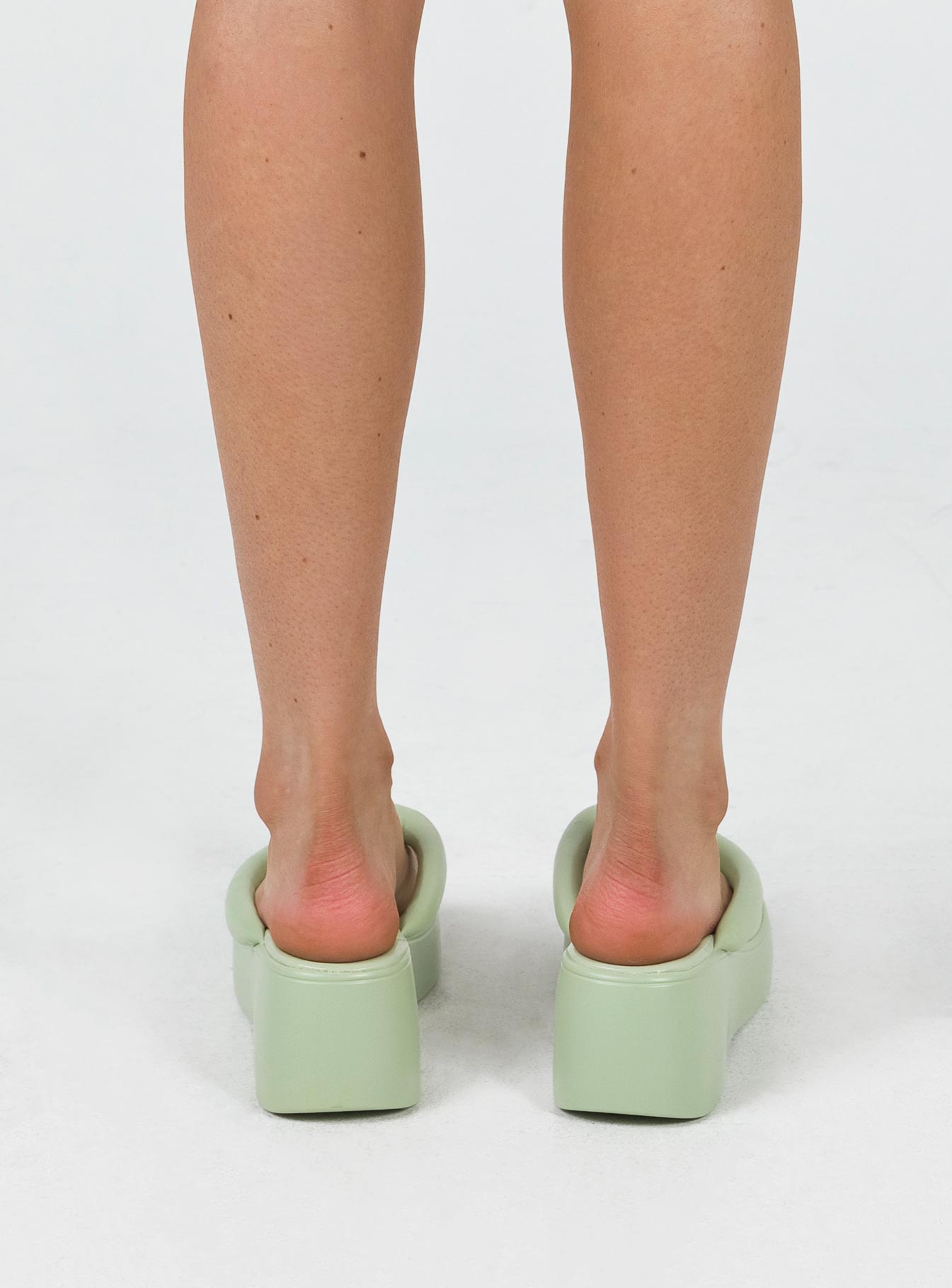 Sandals Man made upper, lining & sole Faux leather material Platform base Thong style upper Thick upper Padded footbed Rounded toe