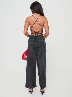 Jumpsuit fastening at back, invisible zip fastening, twin hip &amp; back pockets, partially exposed back, straight leg
