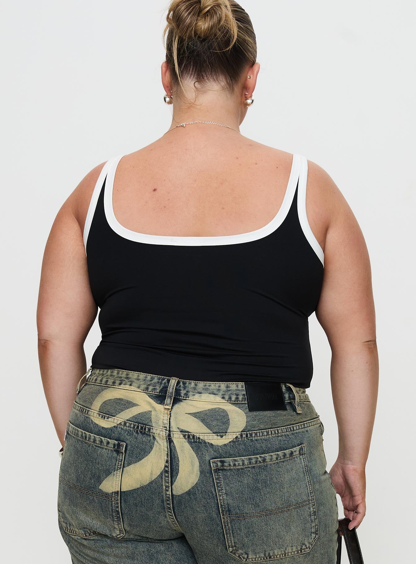 back view of model wearing Princess Polly Astrea Bodysuit Black / White Curve Sleeveless 