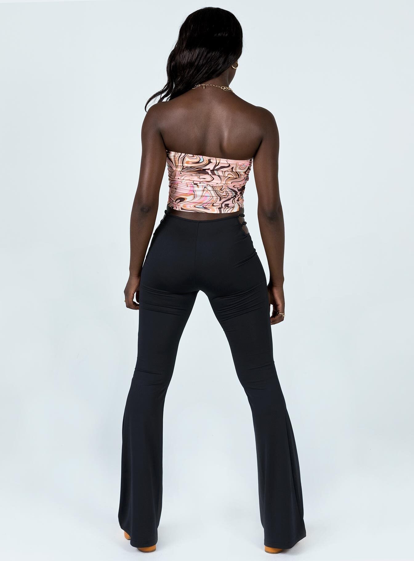 back view of model wearing Princess Polly Jess Cut Out Pants Black 