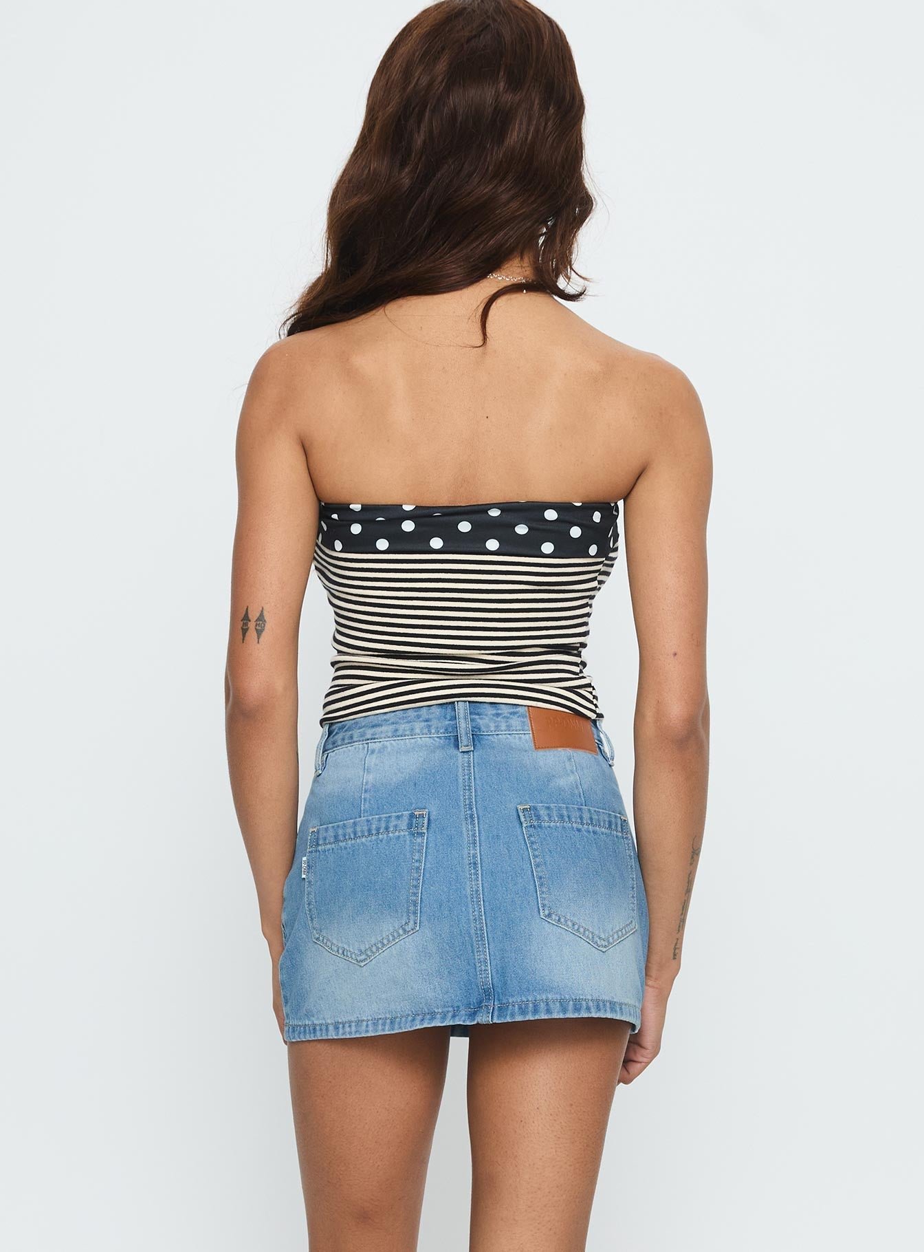 back view of model wearing Princess Polly Cailin Denim Mini Skirt Light Blue Wash 